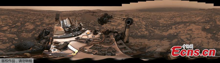 After snagging a new rock sample on Aug. 9, NASA\'s Curiosity rover surveyed its surroundings on Mars, producing a 360-degree panorama of its current location on Vera Rubin Ridge. The panorama includes umber skies, darkened by a fading global dust storm. It also includes a rare view by the Mast Camera of the rover itself, revealing a thin layer of dust on Curiosity\'s deck. (Photo/NASA)