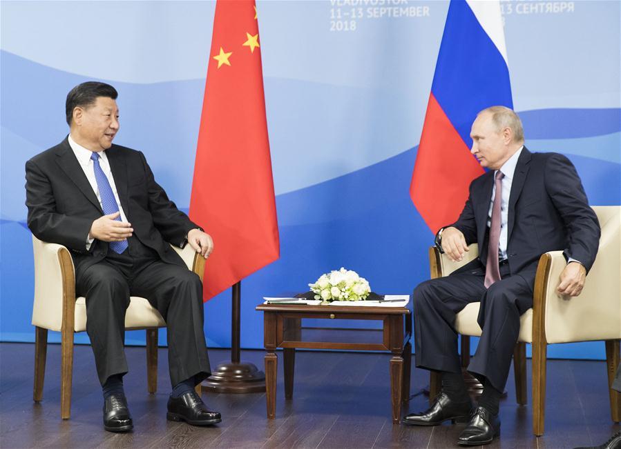 Chinese President Xi Jinping (L) holds talks with Russian President Vladimir Putin in Vladivostok, Russia, Sept. 11, 2018. (Xinhua/Huang Jingwen)