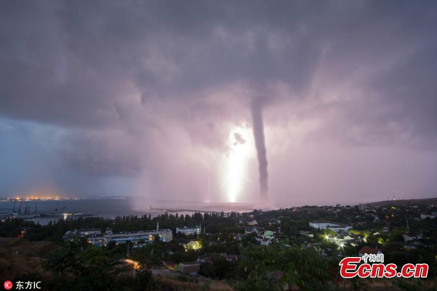 <?php echo strip_tags(addslashes(Photo taken by Andrei Sheliakin shows the rare tornadic waterspout in Crimea amid lightning. (Photo/IC))) ?>