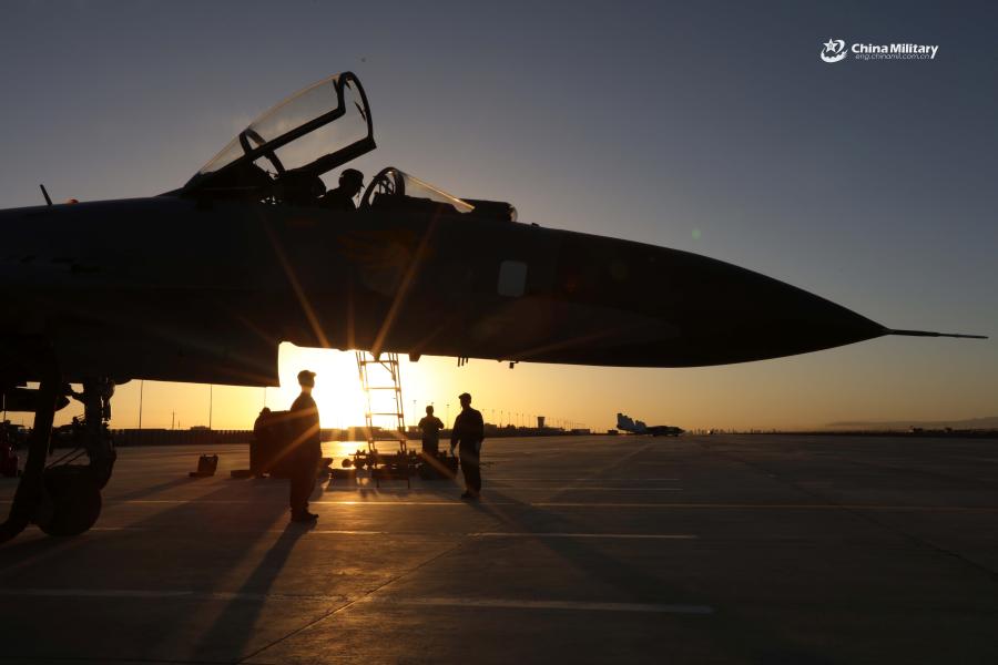 Maintenance men assigned to an aviation brigade of the air force under the PLA Western Theater Command go through pre-flight procedures on a J-11 fighter jet prior to the flight training exercise in the hinterland of the Kunlun Mountains in early September, 2018. (Photo/eng.chinamil.com.cn)
