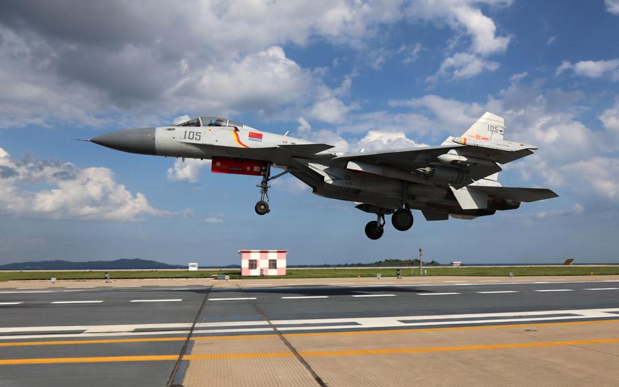 A J-15 fighter jet in training. (Photo provided to chinadaily.com.cn)

The people\'s Liberation Army Navy\'s carrier-based fighter jet force has achieved a number of breakthroughs in its training since May 2013, when it was established.

By now, several batches of Navy pilots have become qualified to take off and land the J-15 fighter jet on the CNS Liaoning aircraft carrier.

Some have been exposed to fierce live-fire exercises that included sophisticated fighting scenarios.

An elite team among the pilots also has carried out night landings, widely considered the riskiest carrier-based action, and have become capable of performing round-the-clock, all-weather operations.