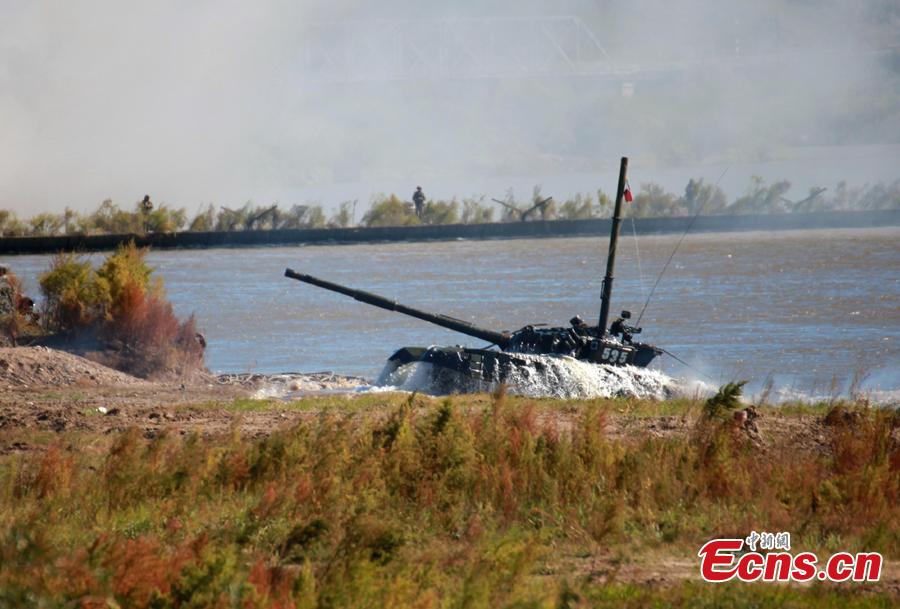 <?php echo strip_tags(addslashes(Photo taken on Sept. 13, 2018 shows the Vostok-2018 (East-2018) military exercise at the Tsugol training range in the Trans-Baikal region in Russia. The drills are aimed at consolidating and developing the China-Russia comprehensive strategic partnership of coordination, deepening pragmatic and friendly cooperation between the two armies, and further strengthening their ability to jointly deal with varied security threats, the Chinese Ministry of National Defense announced. (Photo: China News Service/Li Chun))) ?>