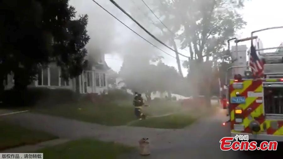 <?php echo strip_tags(addslashes(Firefighters work near a building emitting smoke after explosions in North Andover, Massachusetts, United States in this September 13, 2018 still image from social media video footage by Boston Sparks. (Photo/Agencies))) ?>