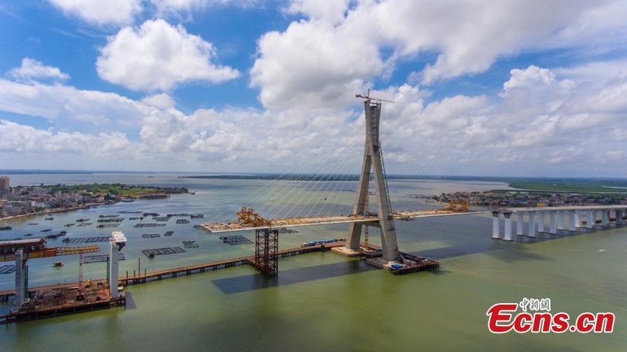 A view of the Puqian Bridge under construction in South China\'s Hainan Province, Sept. 14, 2018. Construction of the cross-sea bridge, scheduled for completion at the end of 2018, will cut the trip from Wenchang City to Haikou City from 90 minutes to about 20 minutes. Spanning a geological fault line, it’s being built to the highest standard of earthquake resistance at an investment of 3.01 billion yuan ($440 million). The 5.6-km-long bridge is expected to promote economic growth in the northern part of Hainan Province. (Photo: China News Service/Luo Yunfei)