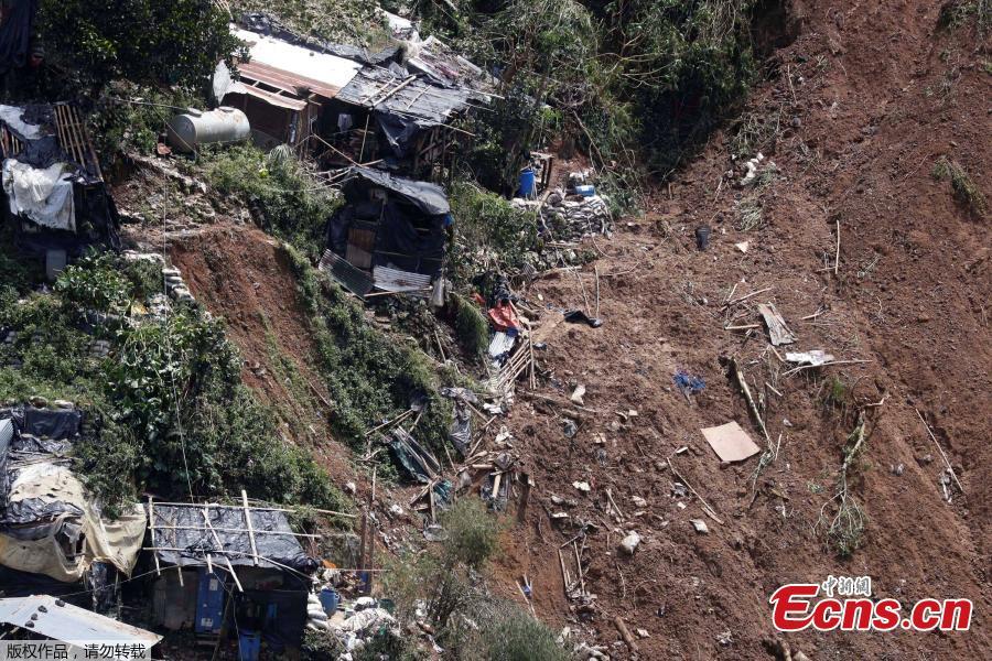 Rescuers dig on the site where victims were believed to have been buried by a landslide after Typhoon Mangkhut barreled across Itogon, Benguet province, northern Philippines, Sept. 17, 2018. Itogon Mayor Victorio Palangdan said that at the height of the typhoon\'s onslaught Saturday afternoon, dozens of people, mostly miners and their families, rushed into an old three-story building in the village of Ucab. The building, a former mining bunkhouse that had been transformed into a chapel, was obliterated when part of a mountain slope collapsed. (Photo/Agencies)