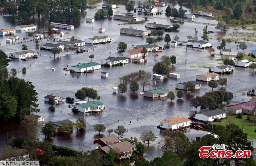Houses sit in floodwater caused by Hurricane Florence, in this aerial picture, on the outskirts of Lumberton, North Carolina, U.S. Sept. 16, 2018. Deadly storm Florence drenched North Carolina with more downpours on Sunday, cutting off the coastal city of Wilmington, damaging tens of thousands of homes and threatening worse flooding as rivers fill to the bursting point. (Photo/Agencies)