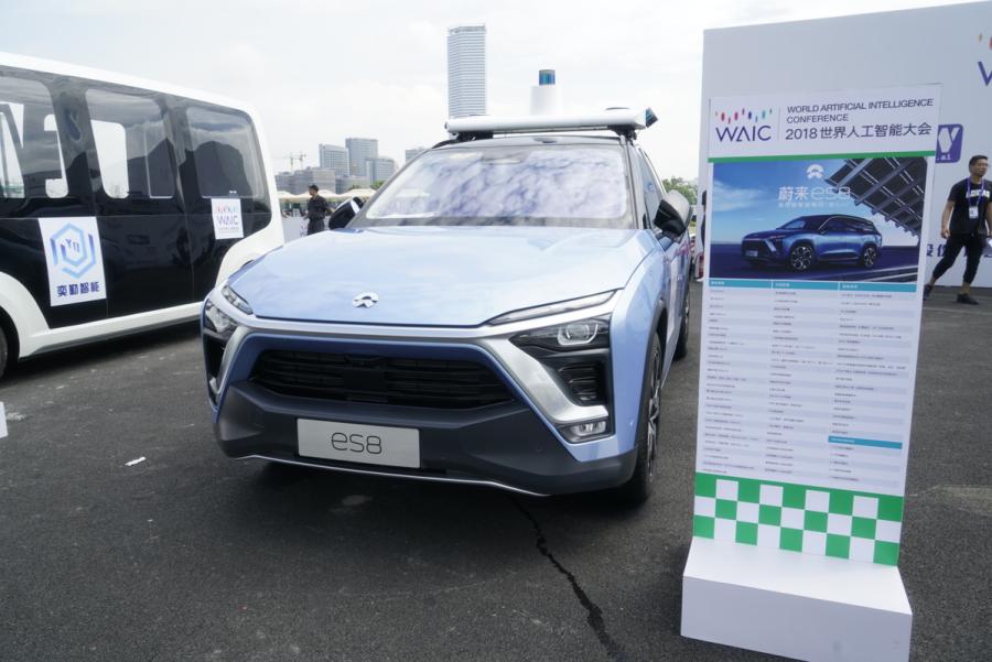 Automated driving vehicles are displayed in the AI Park Interactive Displays section during the World Artificial Intelligence Conference 2018 in Shanghai on Sept 18. The types of vehicles on show include sedans, buses, sanitation trucks and delivery vehicles. (Photo provided to chinadaily.com.cn)