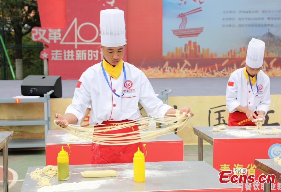 A contestant makes Lamian (hand-pulled noodles) during a contest in Haidong City, Northwest China’s Qinghai Province, Sept. 18, 2018. Nearly 200 contestants from 60 teams from across the nation participated in the Lamian skills contest, where they competed to make five versions of Lamian in different thicknesses. (Photo: China News Service/Ma Mingyan)