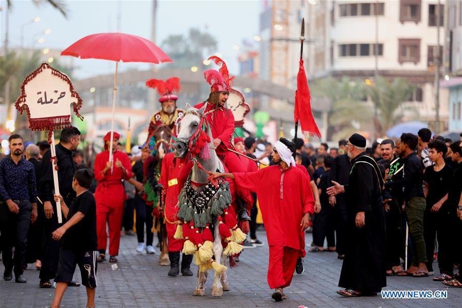 People participate in the celebration of upcoming Ashura in Baghdad, Iraq, Sept. 19, 2018. Ashura, the 10th day of the Islamic month of Muharram, marks the martyrdom of Imam Hussein, the grandson of Prophet Mohammad, in the battle of Kerbala in Iraq in the year 680. (Xinhua/Khalil Dawood)