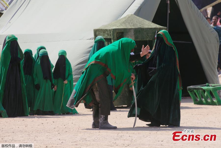 <?php echo strip_tags(addslashes(Local actors dressed as ancient warriors re-enact a scene from the 7th century battle of Karbala to commemorate Ashura in Najaf, Sept. 20, 2018. (Photo/Agencies))) ?>