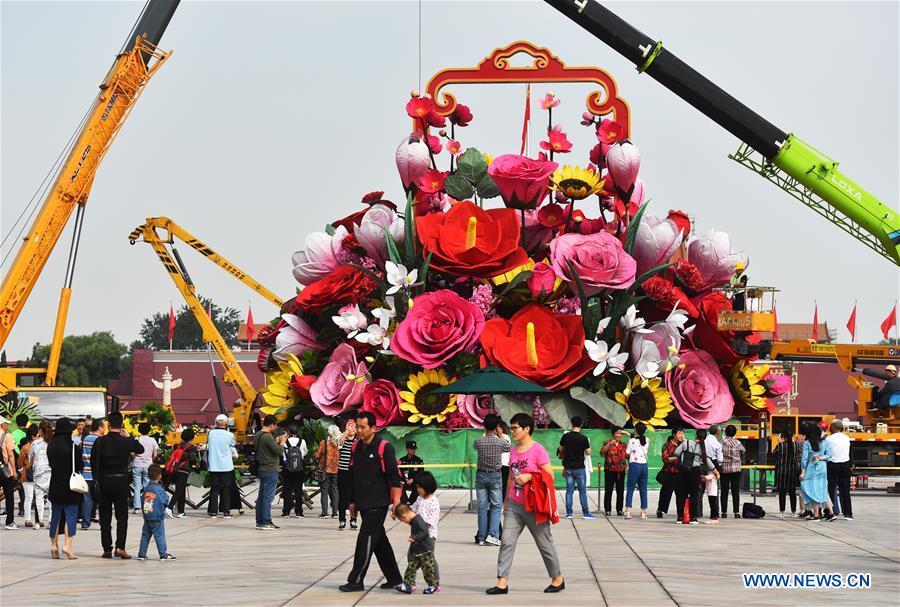 An artificial flower basket is placed at the Tiananmen Square in Beijing, capital of China, Sept. 20, 2018. A 17-meter-tall installation in the shape of a flower basket with a diameter of 50 meters at the bottom is placed at the center of the Tiananmen Square as a decoration for China\'s upcoming National Day holiday. (Xinhua/Luo Xiaoguang)