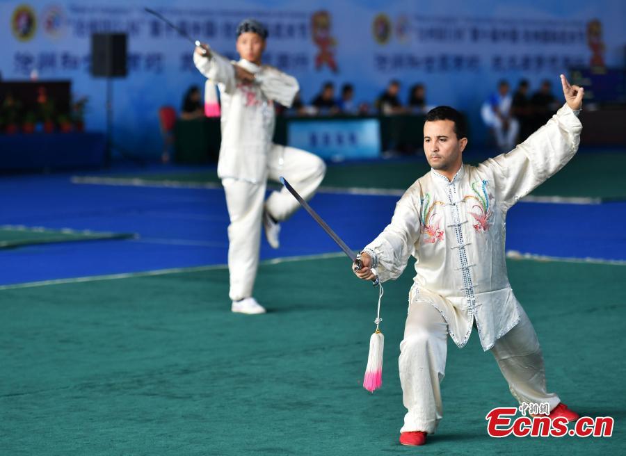 Two foreign participants perform at the 10th Cangzhou International Wushu Festival in Cangzhou City, North China’s Hebei Province, Sept. 20, 2018. Some 2,200 participants from 50 countries and regions will participate in the contest from Sept. 19 to 22. The festival helps promote cultural exchange and better understanding of martial arts. Cangzhou is one of the birthplaces of Chinese martial arts and is also known for its acrobatics. (Photo: China News Service/Zhai Yujia)