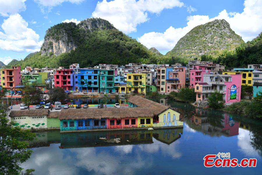 <?php echo strip_tags(addslashes(A view of the colorful buildings at Heye Village in Guangnan County, Southwest China’s Yunnan Province, Sept. 20, 2018. A group of artists began painting buildings and trees in different colors one month ago in order to help attract tourists to the village. (Photo: China News Service/Ren Dong))) ?>