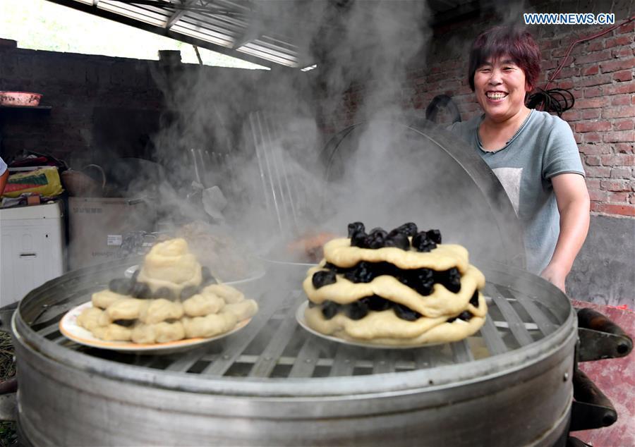 <?php echo strip_tags(addslashes(A villager prepares steamed pastries for a harvest party in Peiligang Village of Xinzheng, central China's Henan Province, Sept. 14, 2018. China will mark its first Farmers' Harvest Festival on Sept. 23 this year. From 2018 on, the festival, to be celebrated on the Autumnal Equinox each year, is set to be observed annually to greet the harvest season and honour the agricultural workers. (Xinhua/Li An))) ?>