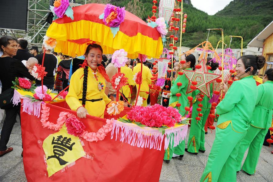 Villagers perform a lantern dance to celebrate China\'s first Farmers\' Harvest Festival in Majiazhai Village of Shuiwei Township in Cengong County, southwest China\'s Guizhou Province, Sept. 23, 2018. People across China hold various activities to celebrate the country\'s first Farmers\' Harvest Festival, which falls on Sept. 23 this year. (Xinhua/Yang Wenbin)