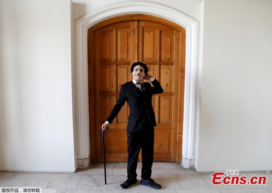 Afghanistan\'s Charlie Chaplin, Karim Asir, 25, reacts before his performance in Kabul, Afghanistan, Aug. 29, 2018. Karim Asir says he has witnessed suicide attacks, explosions and threats from hardline Islamic militant groups, but is determined to waddle and bumble to fulfill the primary goal of his life. (Photo/Agencies)