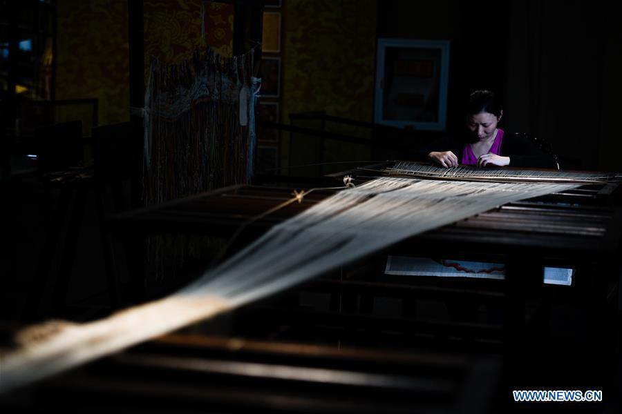 <?php echo strip_tags(addslashes(A weaver shows skills of knitting Yun brocade at the Nanjing Yunjin Museum in Nanjing, capital of east China's Jiangsu Province, Sept. 26, 2018. Yunjin, also called Yun brocade, is traditional Chinese silk brocade made in Nanjing of Jiangsu. Dated from the Eastern Jin Dynasty, it has formed its own characteristics through its development of 1,600 years. Yun brocade is famous for its exquisite craft, elegant patterns and smooth texture, and the making of the artwork requires close cooperation of two weavers, who can produce only five centimeters a day. In 2009, Yun brocade was inscribed on the Representative List of the Intangible Cultural Heritage of Humanity. (Xinhua/Li Xiang))) ?>
