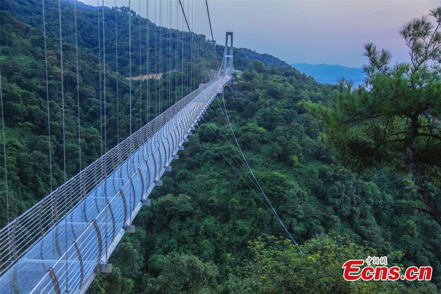 A drone photo shows a 379-meter-long glass bridge built in the Nandan Mountain area in Foshan City, South China’s Guangdong Province, which opened on Sept. 28, 2018 after passing safety test. The glass bridge, suspended 202 meters above the ground, makes use of innovative technology to create impressive sound and visual effects. (Photo: China News Service/Zeng Linghua)