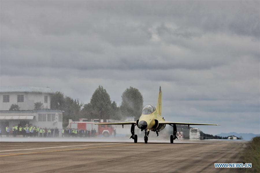 Photo taken on Sept. 28, 2018 shows the FTC-2000G aircraft taxiing on the runway in Anshun, southwest China\'s Guizhou Province. China\'s self-developed FTC-2000G versatile aircraft successfully conducted its maiden flight Friday in the city of Anshun, according to its developer. (Xinhua/Ou Dongqu)