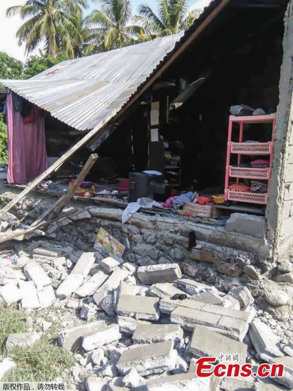 <?php echo strip_tags(addslashes(A handout photo made available by the Indonesian National Board for Disaster Management (BNPB) shows a collapsed house after an earthquake that hit in Donggala, Central Sulawesi, Indonesia, Sept. 28, 2018. A tsunami caused deaths when it hit a small city on the Indonesian island of Sulawesi on Friday after a major quake, collapsing buildings and cutting off power, officials said, although the exact number of casualties was not clear.(Photo/Agencies))) ?>