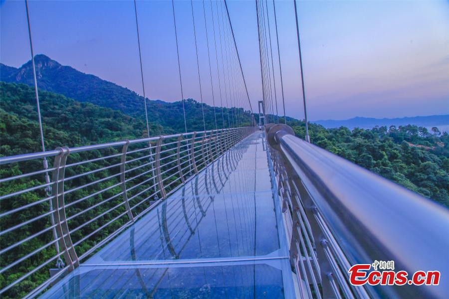 A drone photo shows a 379-meter-long glass bridge built in the Nandan Mountain area in Foshan City, South China’s Guangdong Province, which opened on Sept. 28, 2018 after passing safety test. The glass bridge, suspended 202 meters above the ground, makes use of innovative technology to create impressive sound and visual effects. (Photo: China News Service/Zeng Linghua)