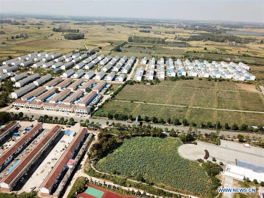 <?php echo strip_tags(addslashes(Aerial photo taken on Sept. 27, 2018 shows the view of Xiaogang Village in Fengyang County, east China's Anhui Province. Xiaogang, known as cradle of China's rural reform, witnessed great change in the past 40 years. (Xinhua/Liu Junxi))) ?>