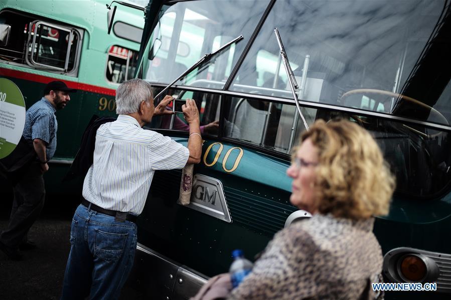 <?php echo strip_tags(addslashes(A man steps on a vintage bus during the 25th Annual Bus Festival in New York, the United States, on Oct. 7, 2018. The New York Transit Museum held its 25th annual bus festival on Sunday. The buses on display represent about 80 years of surface transit history in New York City. The oldest bus at the festival, Bus 1263, is a double-decker bus that was purchased by the Fifth Avenue Bus Company in 1930. (Xinhua/Li Muzi))) ?>