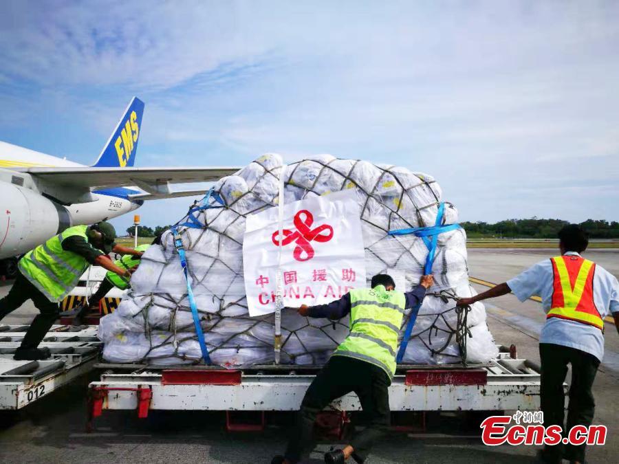 The first batch of humanitarian supplies from the Chinese government for Indonesia\'s quake victims arrives at Balikpapan International Airport in eastern Kalimantan Island, Indonesia, on Oct. 9, 2018. The aid, consisting of tents, water treatment equipment, generators and other supplies, will be delivered to the earthquake and tsunami-hit areas in Central Sulawesi province soon. There are still four batches of this kind of aid to be delivered in days. (Photo provided to China News Service)