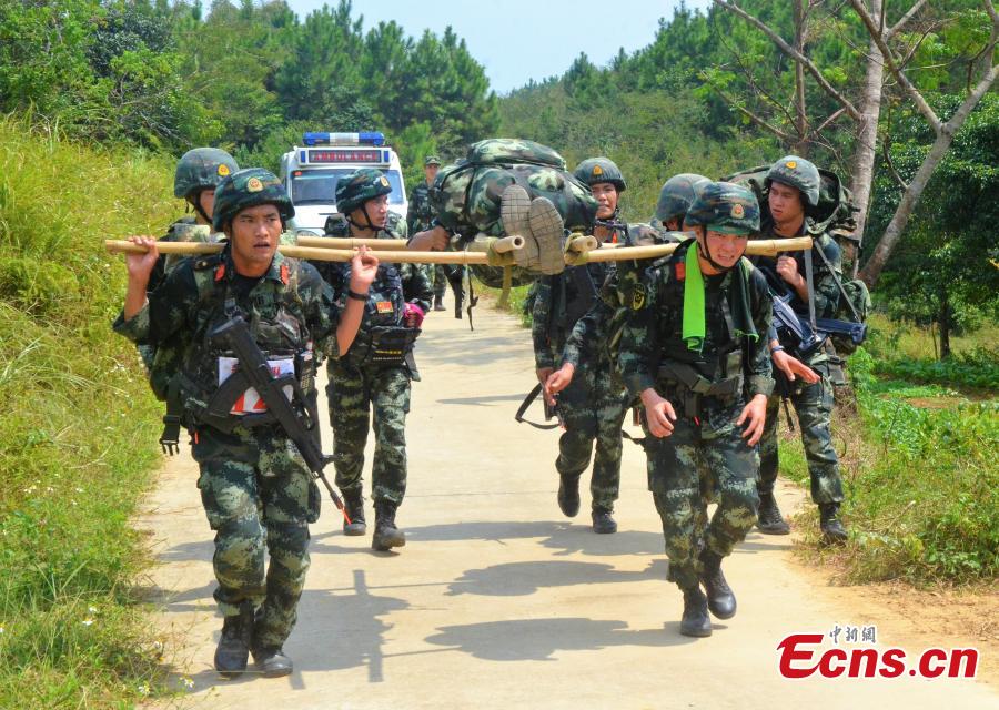 Some 200 Chinese armed police officers receive training in Fangchenggang City, South China’s Guangxi Zhuang Autonomous Region. The week-long training includes demanding search and rescue operations in mountain and forest settings, and rapid response to infection outbreak scenarios. (Photo: China News Service/Cui Cheng)