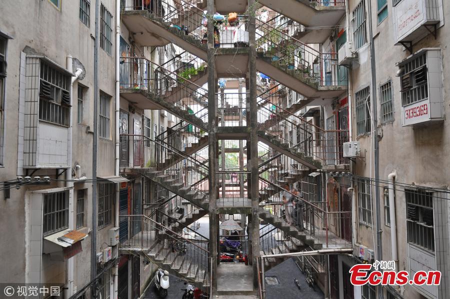 Two residential buildings share a stairwell in a community in Nanning City, South China’s Guangxi Zhuang Autonomous Region, Oct. 11, 2018. (Photo/VCG)