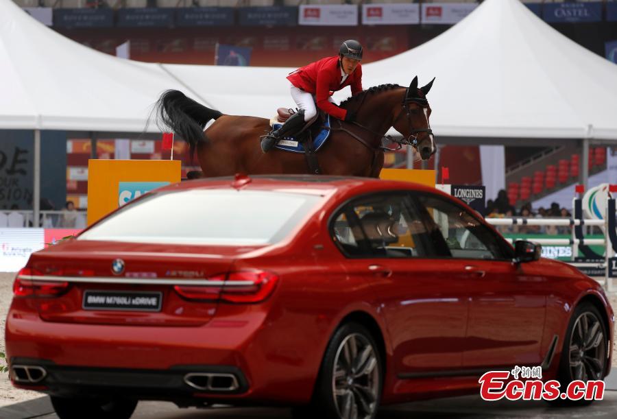 Zhao Zhiwen of China competes in the 8th Longines Equestrian Beijing Masters at the National Stadium in Beijing, Oct. 14, 2018. One of the grandest international equestrian events in China, it was jointly organized by Chinese Equestrian Association and the National Stadium. A total of 251 pairs of horses and riders joined the competition from Oct. 12 to 14, with the total prize money of 2.33 million yuan ($336,000). (Photo: China News Service/Liu Guanguan)
