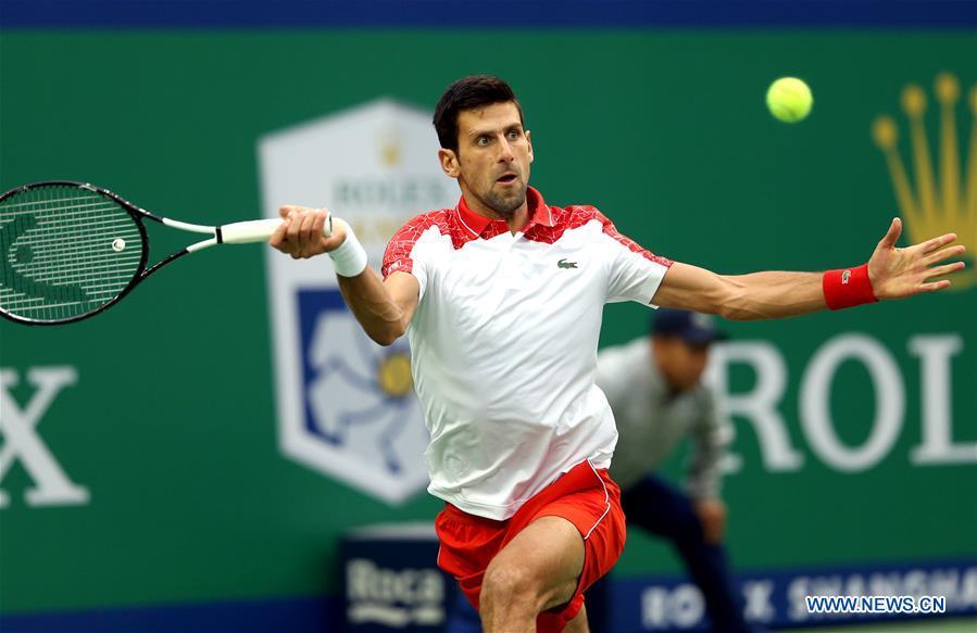 Novak Djokovic of Serbia celebrates after winning the men\'s singles final match against Borna Coric of Croatia at 2018 ATP Shanghai Masters tennis tournament in Shanghai, east China, Oct. 14, 2018. Novak Djokovic won 2-0 in the final and claimed the title of the event. (Xinhua/Fan Jun)