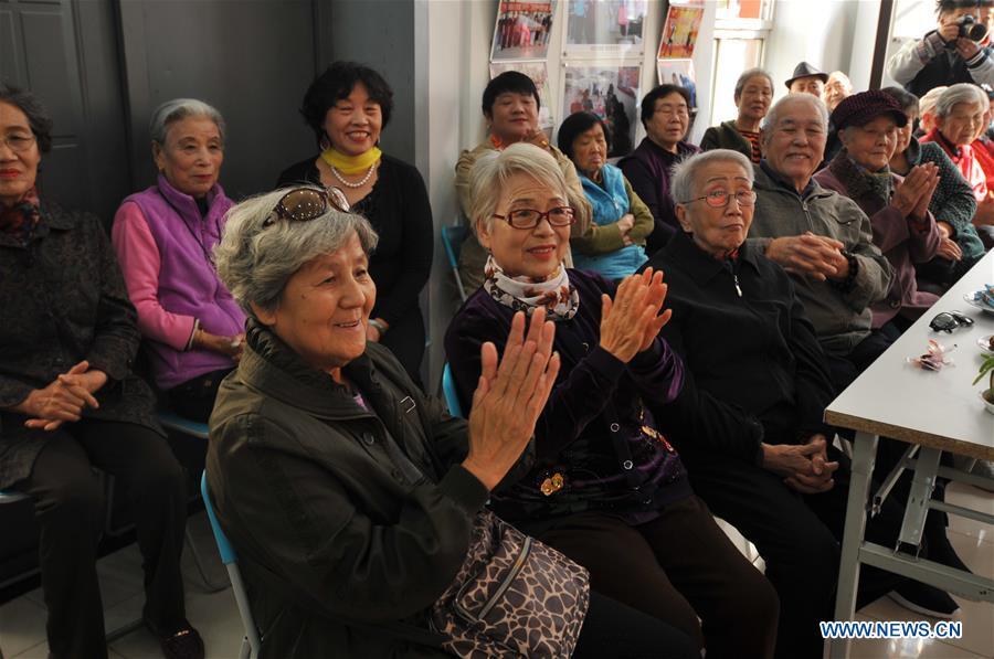 Residents gather in Hetaoyuan community of Xicheng District in Beijing, capital of China, Oct. 16, 2018. Senior residents in the community got together to watch a performance celebrating the upcoming Chongyang Festival, a day to pay respect to seniors that falls on the ninth day of the ninth lunar month, which is on Oct. 17 this year. (Xinhua/Zhao Yusi)