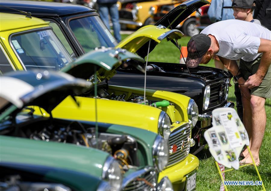 A man looks at details of a BMW MINI Cooper vehicle in Wellington, New Zealand, Oct. 20, 2018. More than 120 BMW MINI Cooper vehicles are displayed during the 24th Mini Nationals Show and Shine. (Xinhua/Guo Lei)