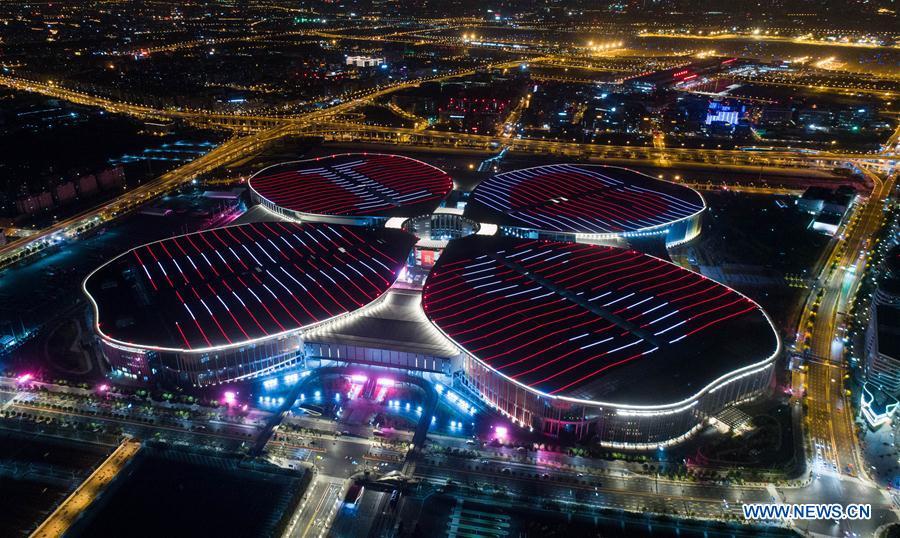 <?php echo strip_tags(addslashes(Photo taken on Oct. 21, 2018 shows a night view of the National Exhibition and Convention Center (Shanghai) in Shanghai, east China. The six-day China International Import Expo (CIIE) will be opened in the center on Nov. 5. (Xinhua/Ding Ting))) ?>