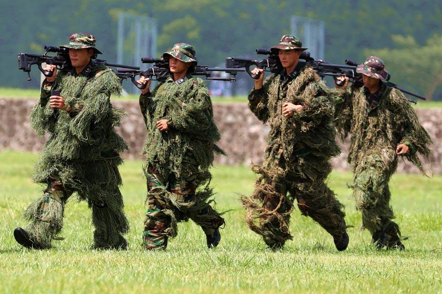 The PLA Navy Marine Corps members return from sniper training. (PHOTO/CHINA DAILY)