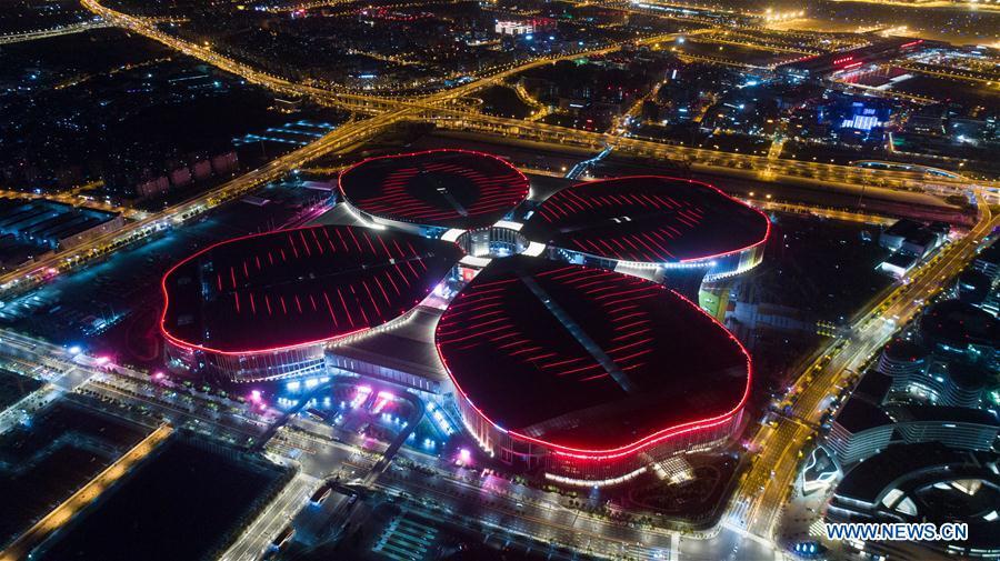 Photo taken on Oct. 21, 2018 shows a night view of the National Exhibition and Convention Center (Shanghai) in Shanghai, east China. The six-day China International Import Expo (CIIE) will be opened in the center on Nov. 5. (Xinhua/Ding Ting)