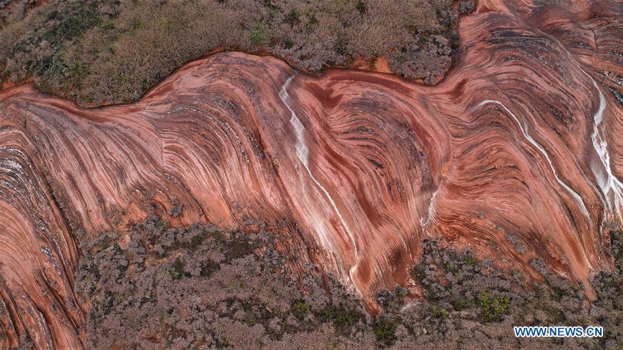 Aerial photo taken on Oct. 21, 2018 shows a view of Danxia landform at Wangjiawan of Pingqiao Town in Ansai District of Yan\'an, northwest China\'s Shaanxi Province. Danxia landform is a unique type of geomorphology formed from red-colored sandstones and characterized by steep cliffs. (Xinhua/Tao Ming)