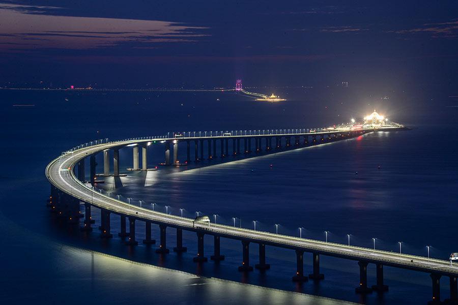 The Hong Kong-Zhuhai-Macao Bridge and tunnel seen on Sunday, as final preparations were made for its opening on Wednesday. (Photo by Vincent Chan/ for China Daily)

8. Why the bridge does not connect to Shenzhen?

Looking toward the future of the Guangdong-Hong Kong-Macao Greater Bay Area, Liu Xiaodong, a major designer of HZMB, told China Daily that there will be five bridges across the Pearl River Estuary by around 2035, or one sea crossing every 20 kilometers parallelly.

Future traffic demand was taken into account during the preliminary design for the bridge, back in 2003, Liu said.

\