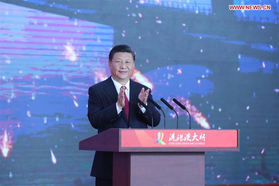 Chinese President Xi Jinping, also general secretary of the Communist Party of China Central Committee and chairman of the Central Military Commission, announces the opening of the Hong Kong-Zhuhai-Macao Bridge at an opening ceremony in Zhuhai, south China\'s Guangdong Province, Oct. 23, 2018. (Xinhua/Ju Peng)