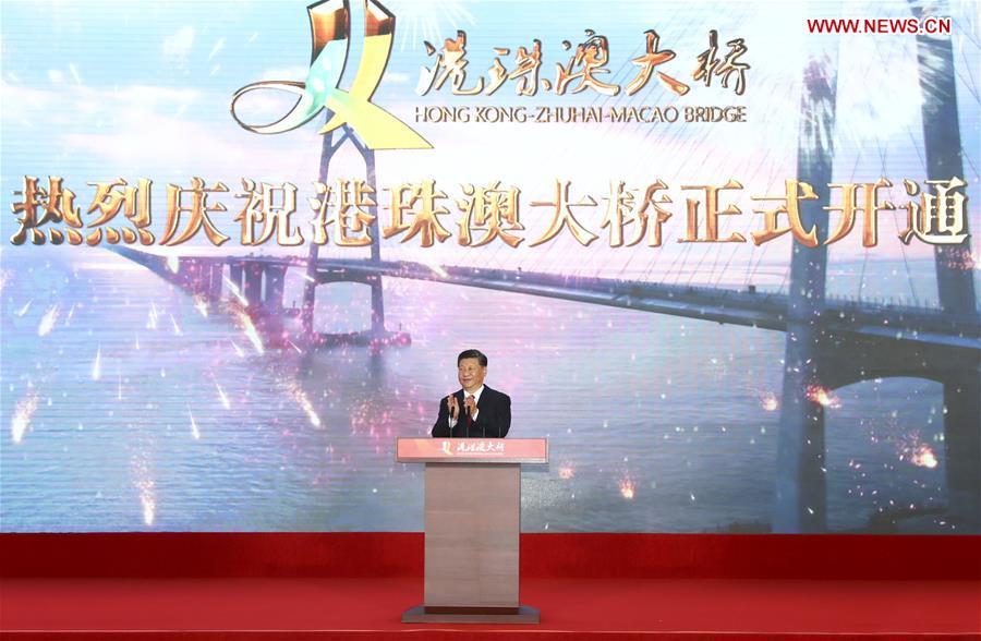 Chinese President Xi Jinping, also general secretary of the Communist Party of China Central Committee and chairman of the Central Military Commission, announces the opening of the Hong Kong-Zhuhai-Macao Bridge at an opening ceremony in Zhuhai, south China\'s Guangdong Province, Oct. 23, 2018. (Xinhua/Xie Huanchi)