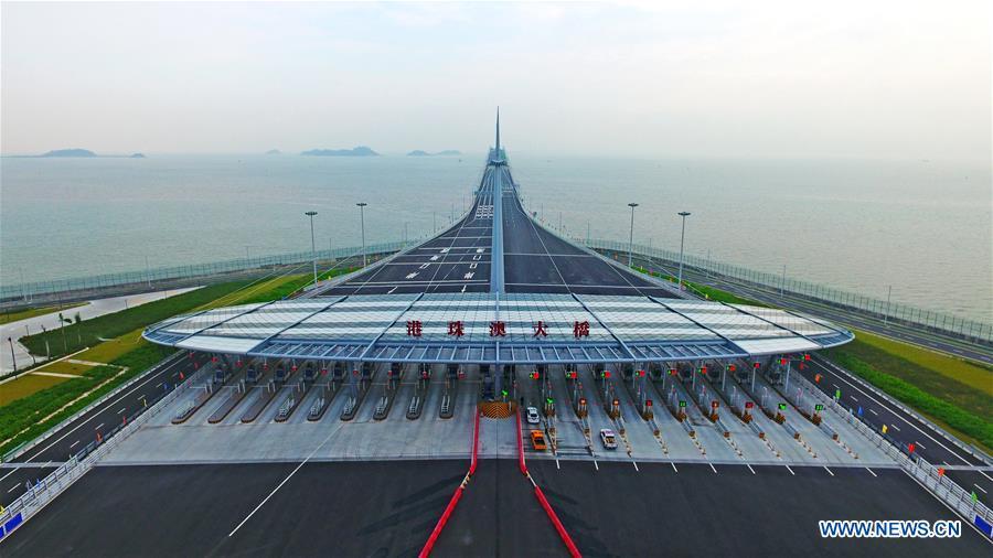 <?php echo strip_tags(addslashes(Aerial photo taken on Oct. 24, 2018 shows the toll gate of the Hong Kong-Zhuhai-Macao Bridge in Zhuhai, south China's Guangdong Province. The bridge officially opened to traffic at 9 a.m. on Oct. 24. (Xinhua/Liang Xu))) ?>