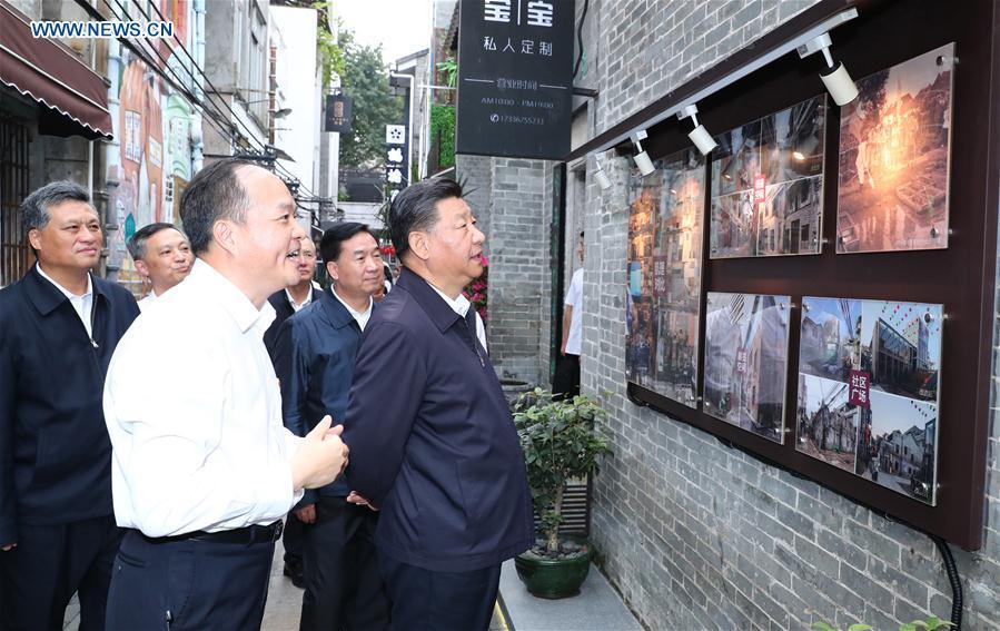 Chinese President Xi Jinping, also general secretary of the Communist Party of China Central Committee and chairman of the Central Military Commission, visits the Xiguan historical and cultural community in Liwan District of Guangzhou, capital of south China\'s Guangdong Province, during an inspection tour, Oct. 24, 2018. (Xinhua/Xie Huanchi)