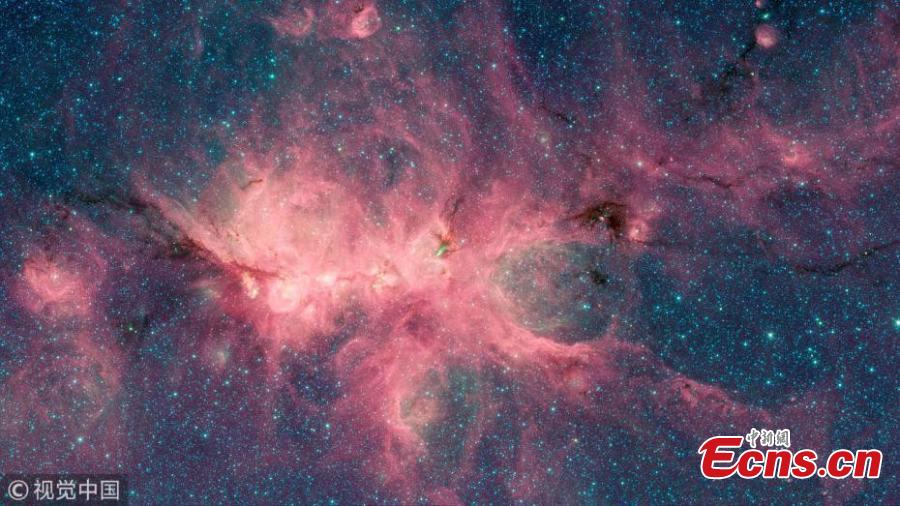 <?php echo strip_tags(addslashes(The Cat's Paw Nebula, imaged here by NASA's Spitzer Space Telescope using the IRAC instrument, is a star-forming region inside the Milky Way Galaxy. The dark filament running through the middle of the nebula is a particularly dense region of gas and dust.(Photo/VCG))) ?>