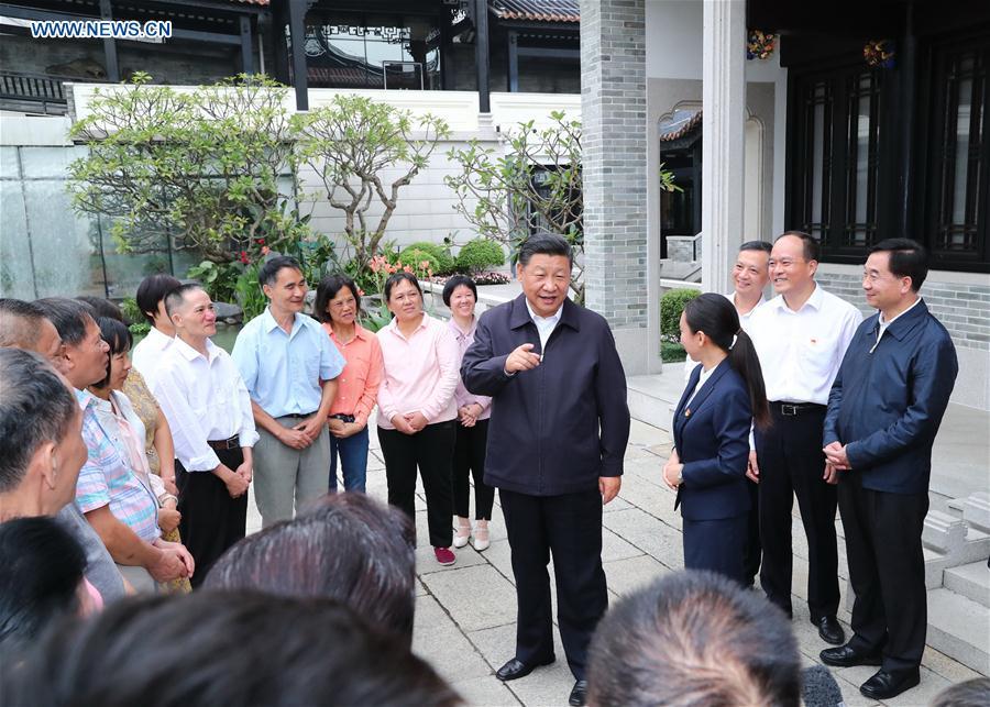 Chinese President Xi Jinping, also general secretary of the Communist Party of China Central Committee and chairman of the Central Military Commission, visits the Xiguan historical and cultural community in Liwan District of Guangzhou, capital of south China\'s Guangdong Province, during an inspection tour, Oct. 24, 2018. (Xinhua/Xie Huanchi)