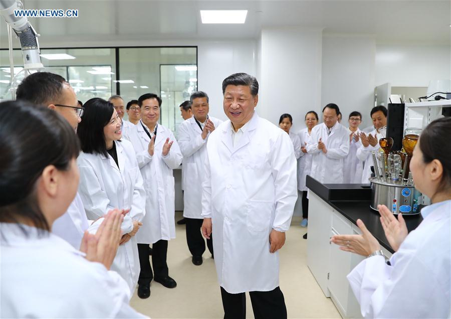 Chinese President Xi Jinping, also general secretary of the Communist Party of China Central Committee and chairman of the Central Military Commission, visits the Traditional Chinese Medicine Science and Technology Industrial Park of Co-operation between Guangdong and Macao in Zhuhai, south China\'s Guangdong Province, Oct. 22, 2018. Xi made an inspection tour in Zhuhai on Monday. (Xinhua/Xie Huanchi)