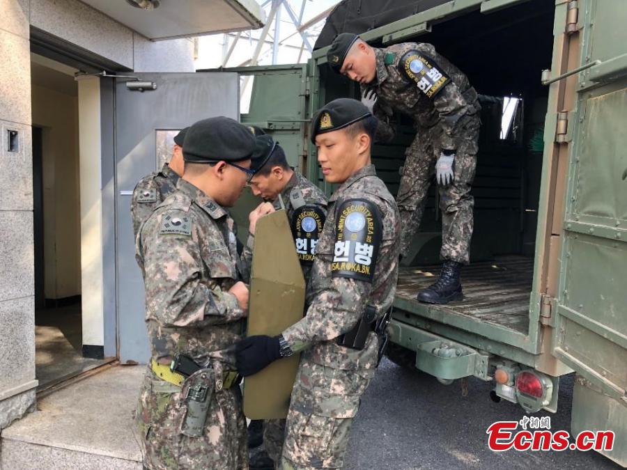 <?php echo strip_tags(addslashes(In this photo provided by South Korea Defense Ministry, South Korean army soldiers work before leaving from the border village of Panmunjom, South Korea, Oct. 25, 2018. Koreas completed withdrawing firearms and troops from a jointly controlled area at the Koreas' border village on Thursday as part of their sweeping agreements to reduce decades-long military animosities on the Korean Peninsula. (Photo/Agencies))) ?>
