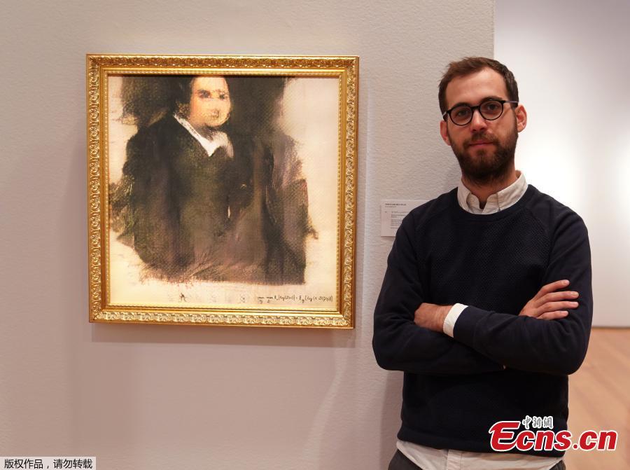 Pierre Fautrel, Co Founder of the team of French entrepreneurs called OBVIOUS which produces art using artificial intelligence, stands next to a work of art created by an algorithm titled \