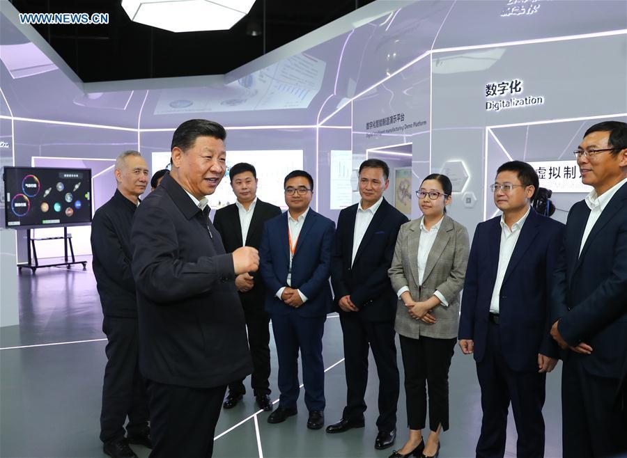 Chinese President Xi Jinping, also general secretary of the Communist Party of China Central Committee and chairman of the Central Military Commission, talks with heads of middle and small-sized private enterprises at an automotive equipment company in Guangzhou, capital of south China\'s Guangdong Province, during an inspection tour, Oct. 24, 2018. (Xinhua/Xie Huanchi)