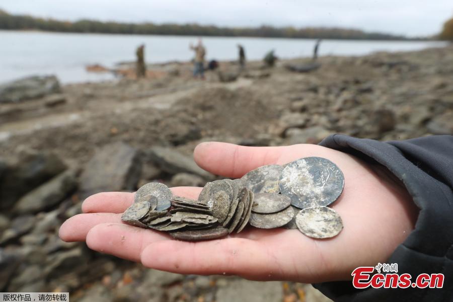 <?php echo strip_tags(addslashes(Hungarian archaeologists inspect the site where they found coins from the 16th-17th centuries and special weapons on the banks of the Danube river due to its low water level on October 25, 2018 near Erd, located 25 kilometers from Budapest. According to archaeologists working on site, the treasure comes from a cargo of a commercial ship that probably sank in the 18th century. (Photo/Agencies))) ?>